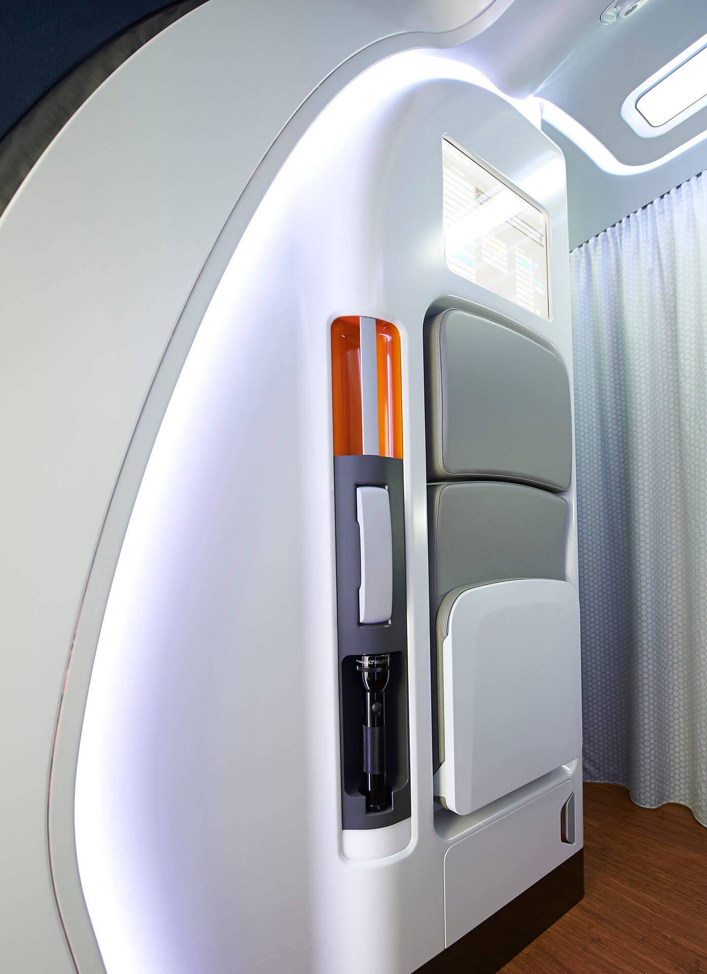 Embraer E2 Aircraft entrance area with flush mounted crew seat and service area design