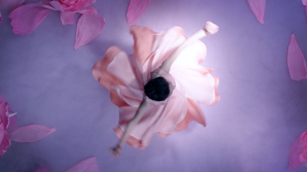Artistic photo of woman dancing seen from above