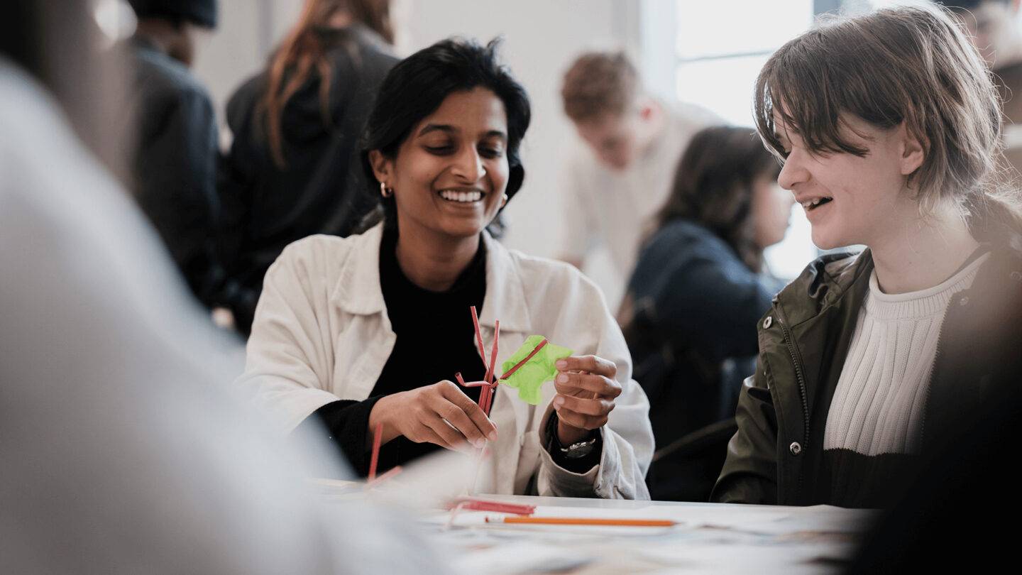 Student and PG member working with straws to design future spaces