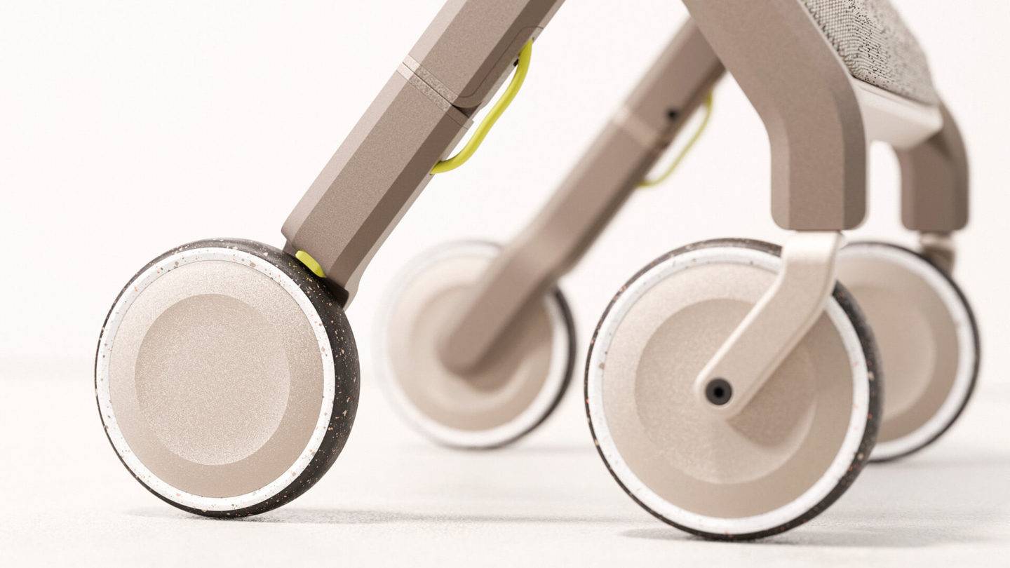 A close up of the WALKABLE's wheels made from recycled rubber and the green lockable break feature