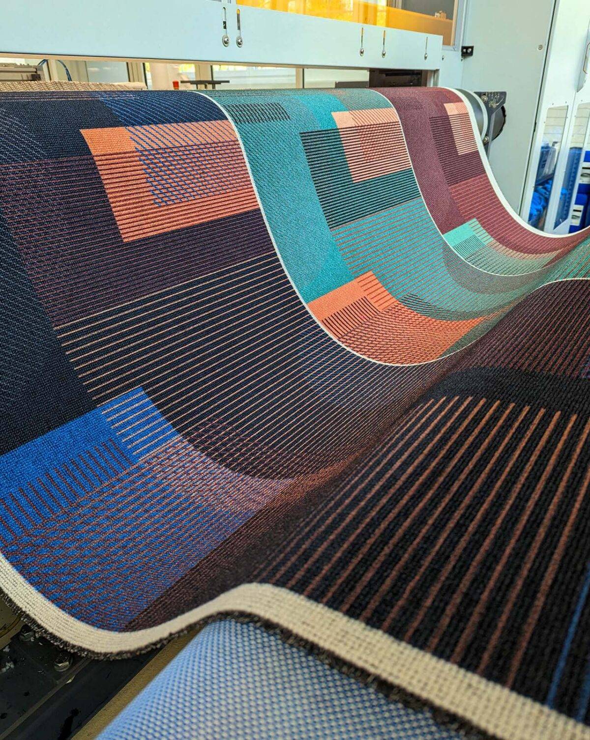 Carpets during production coming off the roller