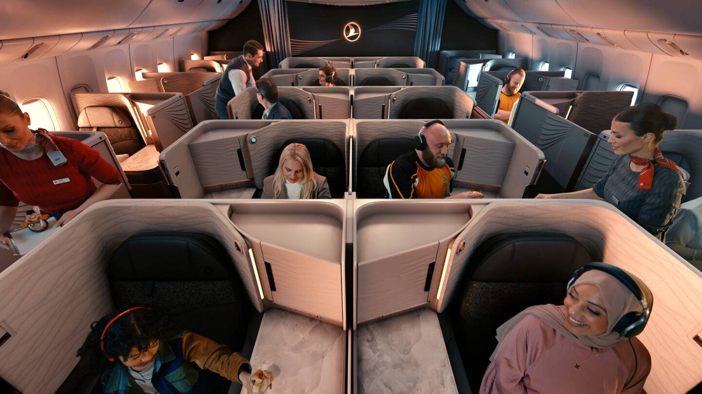 Full Turkish Cabin with a wide range of people sitting in the business class seats.