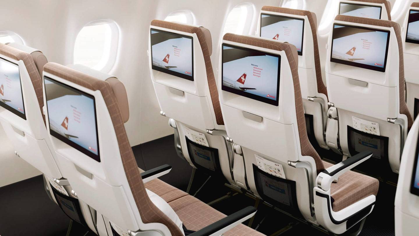SWISS Economy seats rear view showing TV screens on each seat