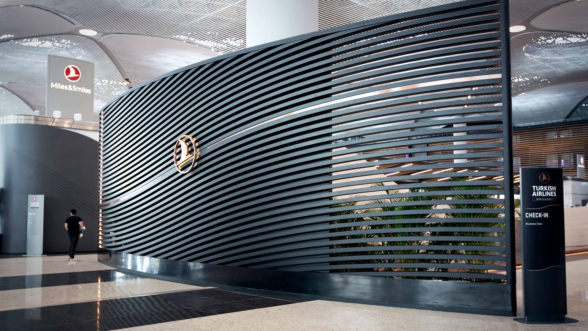 An imposing Business Class dividing panel indicating dedicated Business Class check in area