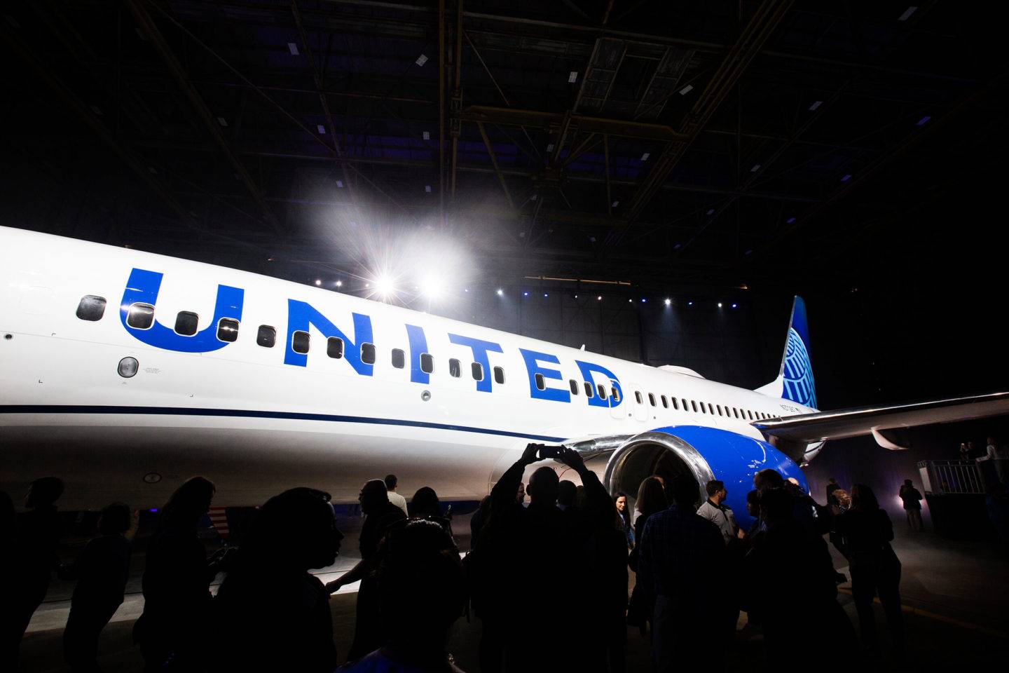 People taking photos of a United aircraft at the launch of the livery