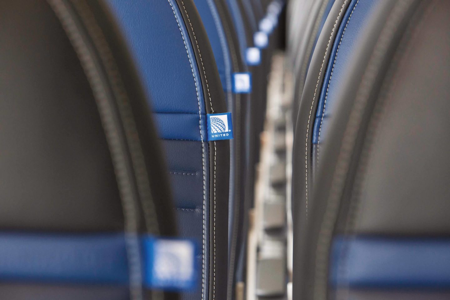Tag with the United logo on the side of aircraft seats
